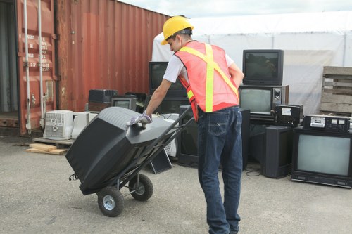 Workers loading furniture from a third-floor apartment